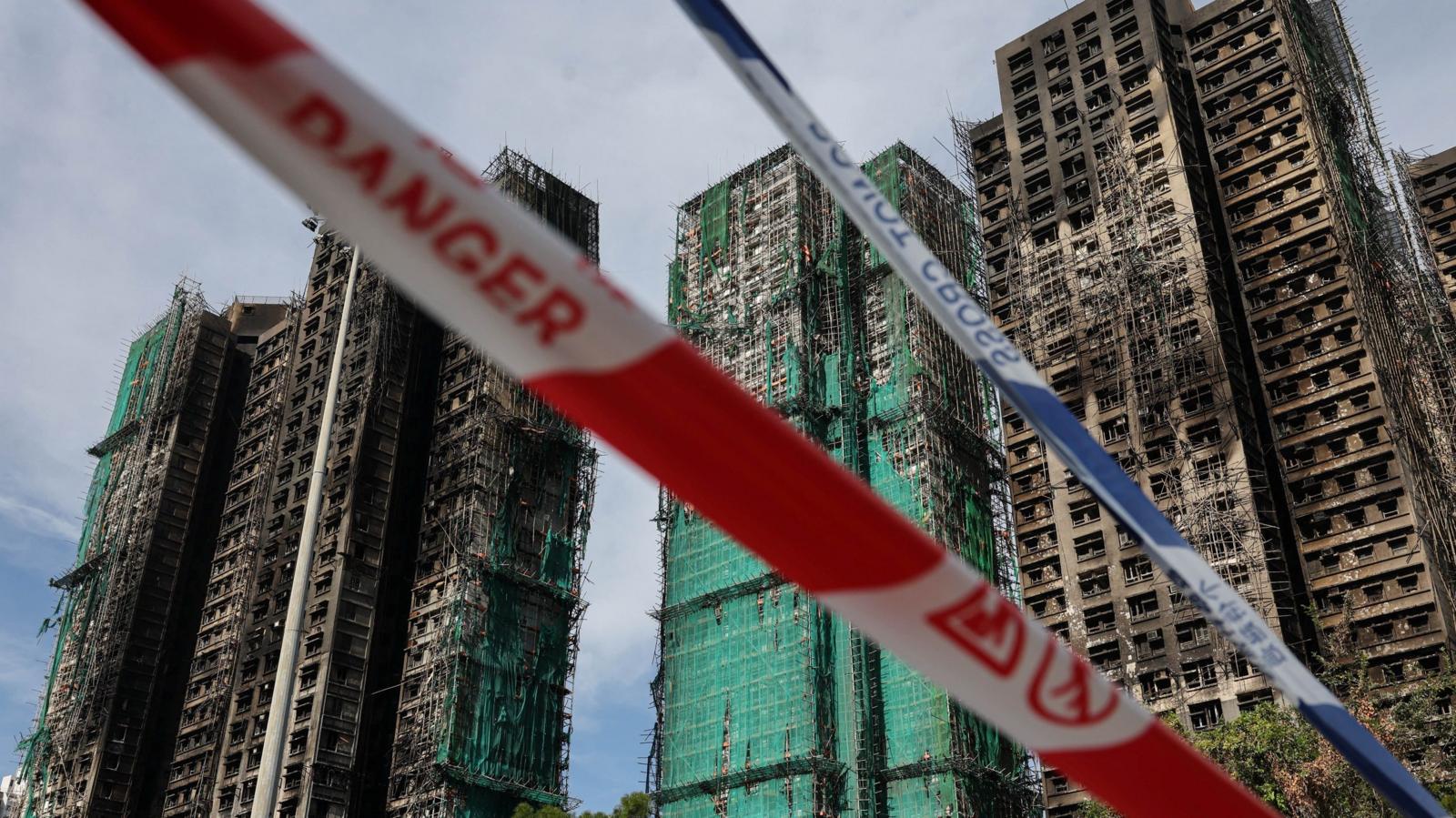 Eight more arrested over fire in Hong Kong that killed at least 128 people
