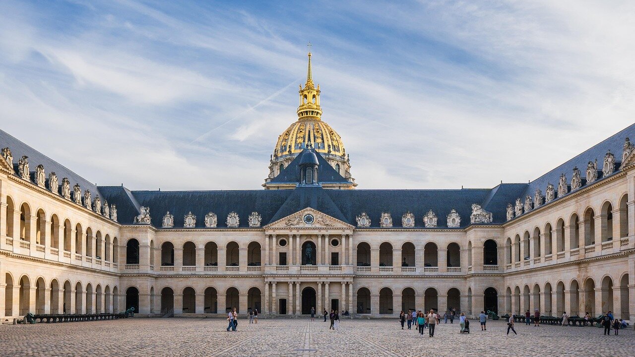 An outdoor scene of a vineyard with a hopeful sunset, symbolizing the potential for recovery in the wine industry