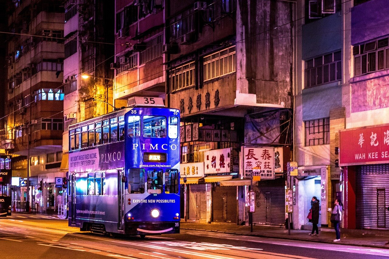 Flames lighting up the night sky as explosions echo through a bustling Hong Kong neighborhood