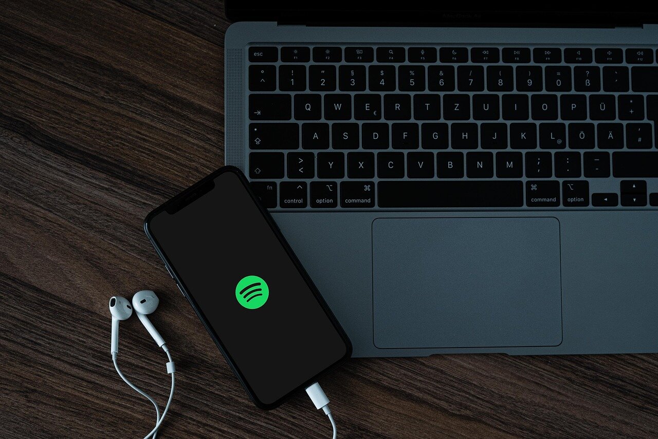 A person listening to music on their smartphone, immersed in the Spotify app interface