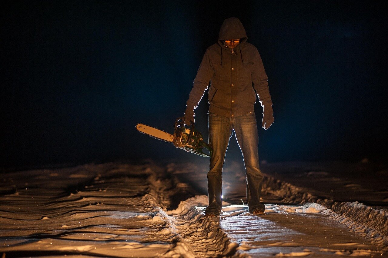 A filmmaker reviewing notes and research materials, emphasizing the meticulous preparation needed for a compelling true crime narrative