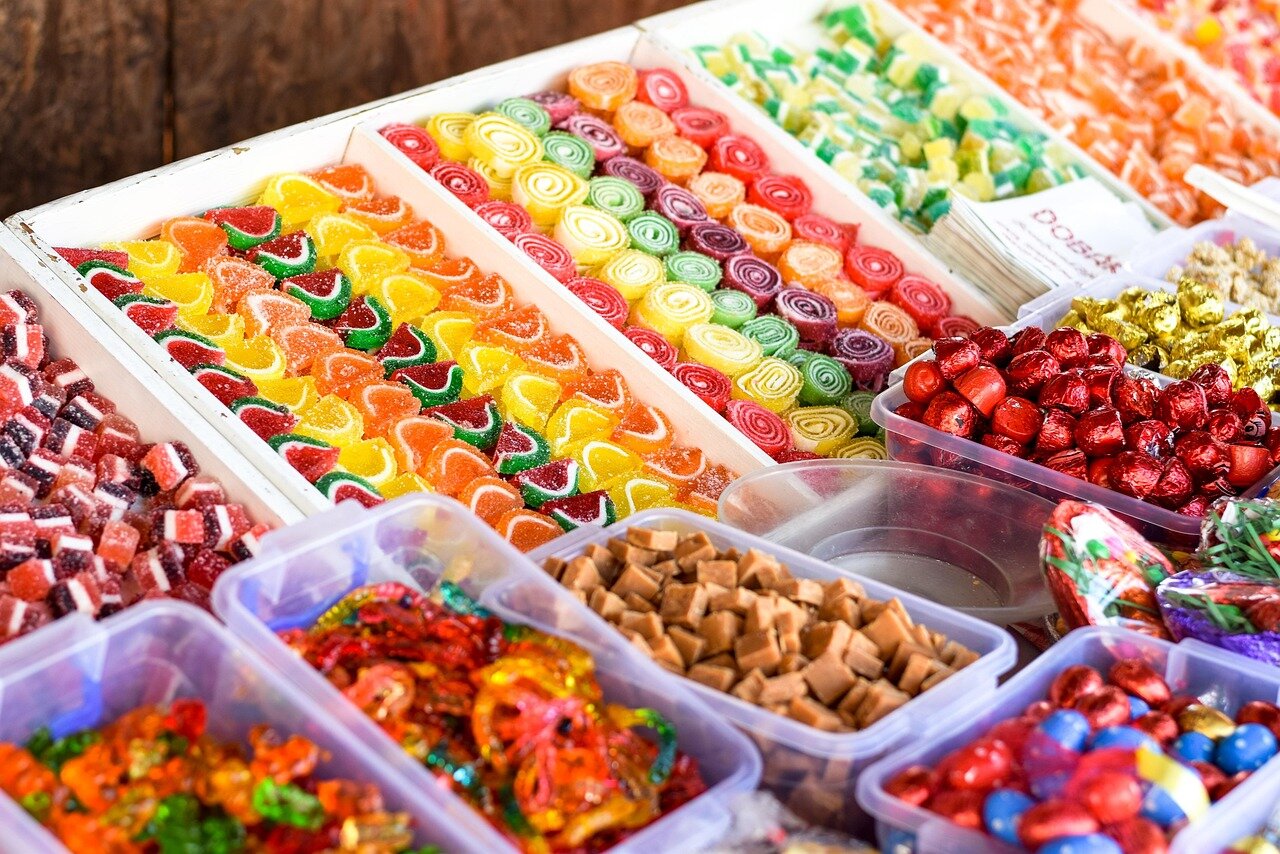 A vibrant assortment of freezedried sweets showcasing an array of colors and textures, highlighting their appeal as a healthier snack alternative