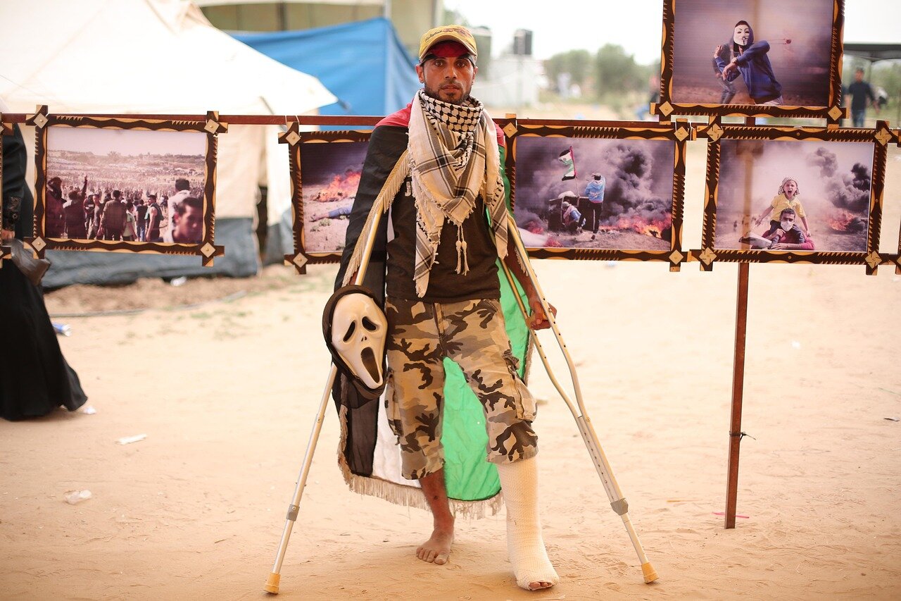 Families navigating bureaucratic processes to secure treatment for their children, showcasing the complexities of healthcare access in conflict areas