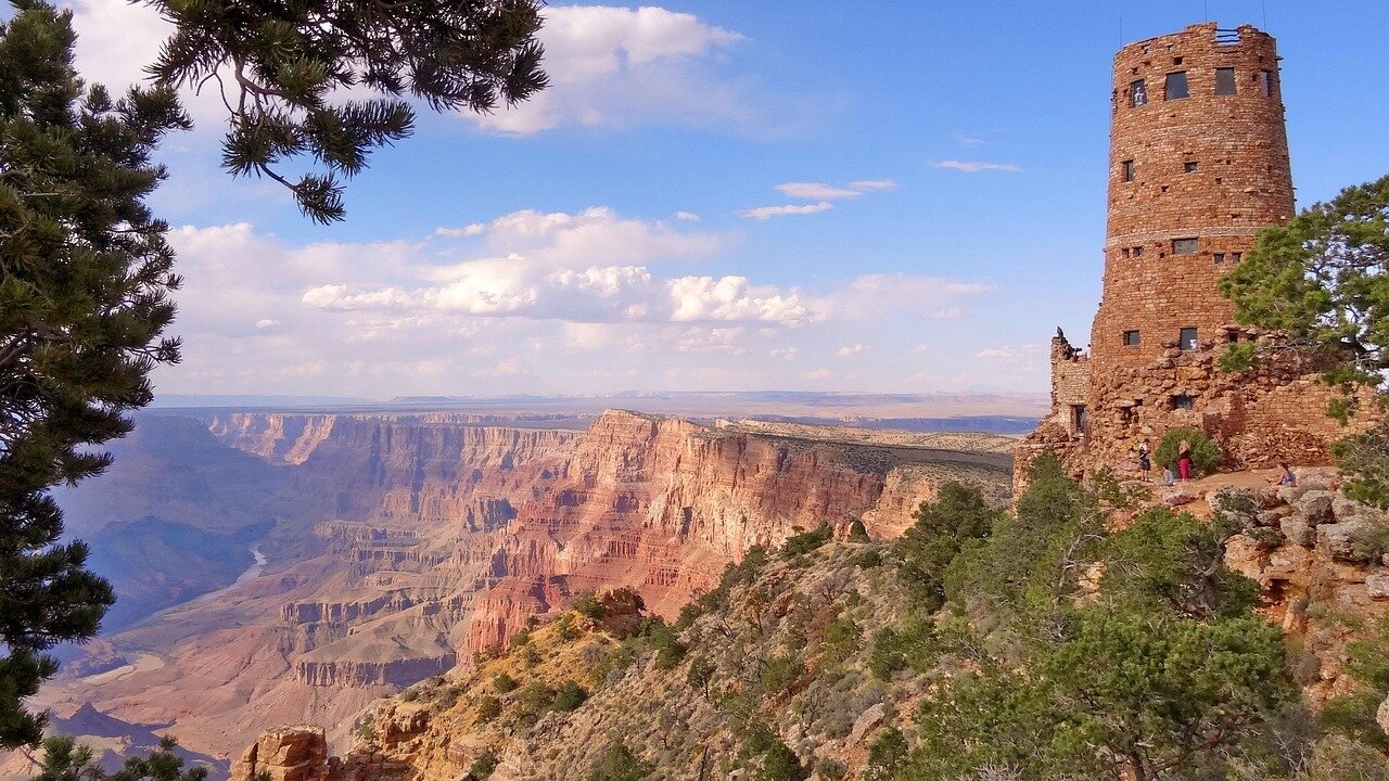 Visitors gathered at a viewpoint, taking in the breathtaking vistas of the Grand Canyon while engaging with the park's environment
