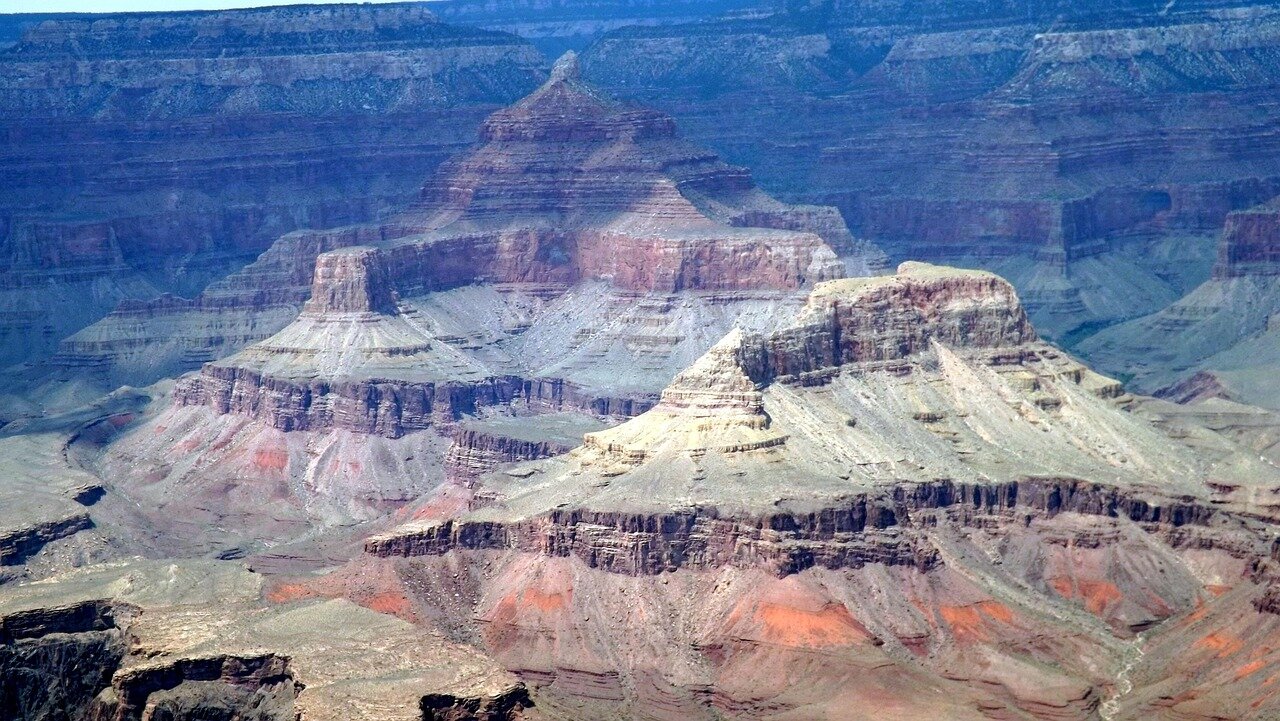 A serene image of the Grand Canyon's diverse terrain, emphasizing the park's allure and the ongoing opportunities for exploration despite the hotel renovations