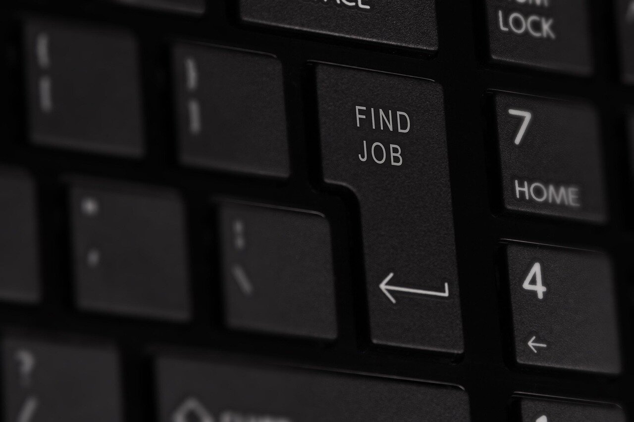A team of HR professionals analyzing data on AI recruitment tools to enhance their hiring strategies