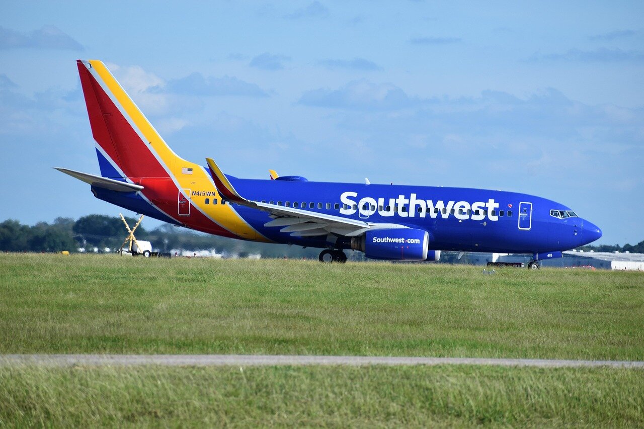 A Southwest Airlines aircraft parked at a gate, highlighting the operational challenges faced by the airline amid winter weather disruptions