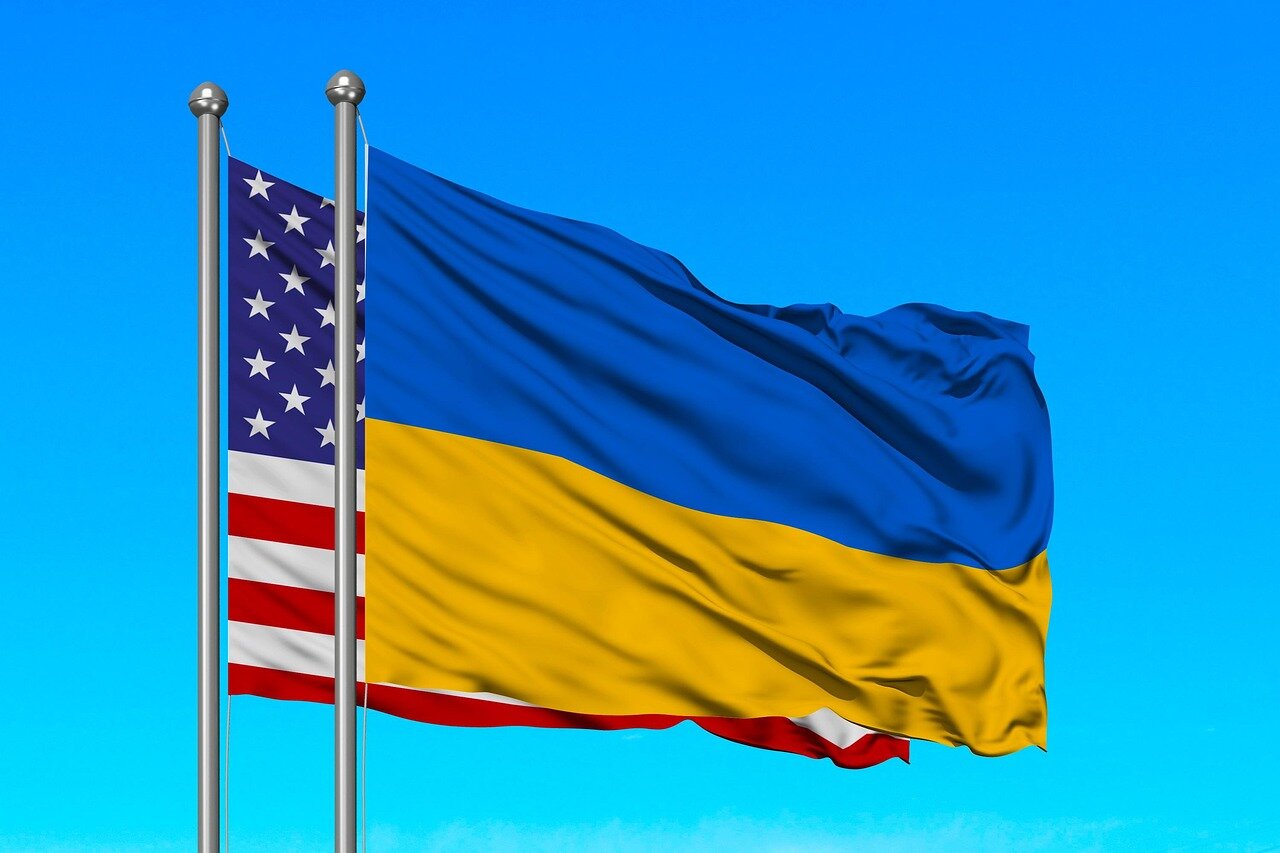 Representatives from international organizations discussing support strategies for Ukraine's peace efforts