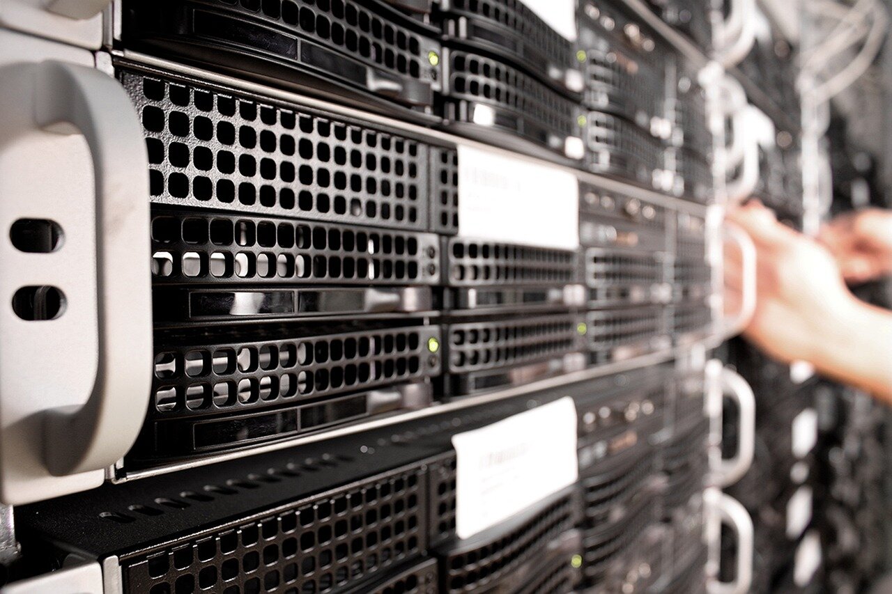 A collaborative meeting between technology companies and data centre operators discussing strategies for enhancing scalability and cost efficiency