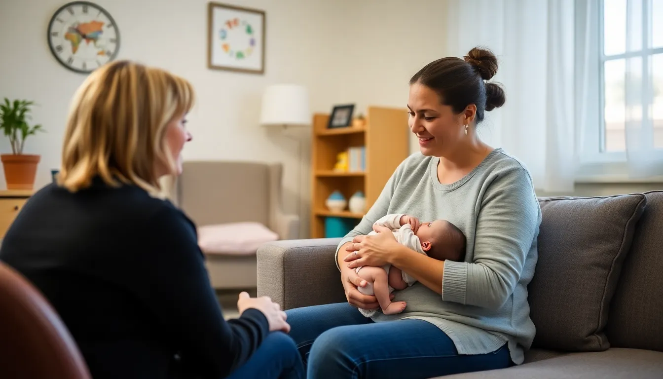 A mother sits in a cozy, welllit room of a mother and baby mental health unit, gently cradling her infant while engaging in a supportive conversation with a healthcare professional.