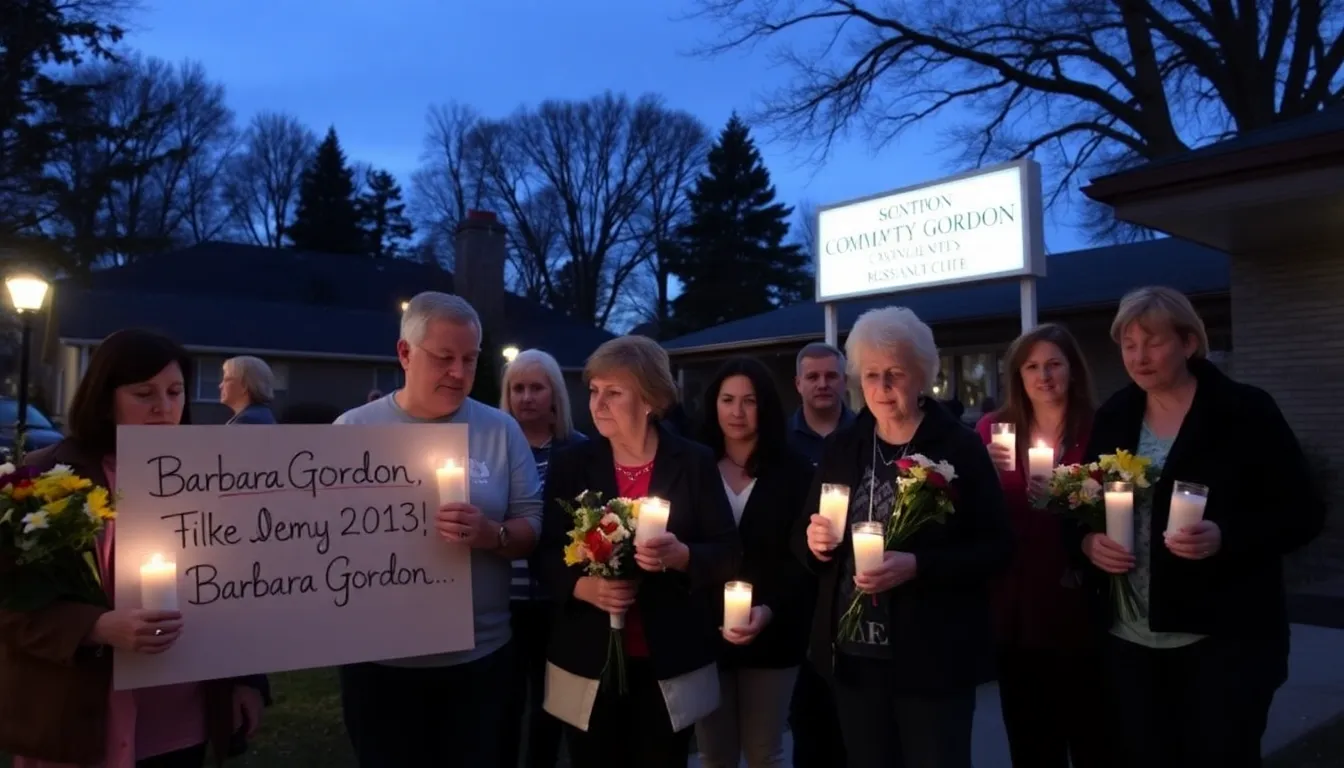 A group of mourners gathers outside a community center, holding candles and flowers in remembrance of Barbara Gordon, reflecting on her contributions to addiction awareness and support.