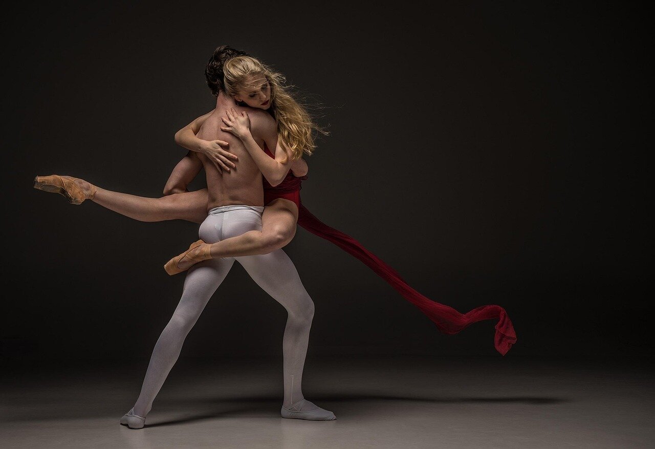 A diverse group of dancers participating in a workshop, celebrating body positivity and inclusivity within the ballet community