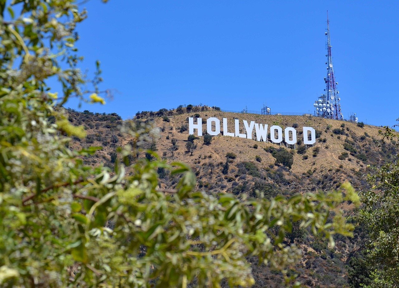 The vibrant atmosphere of the Hollywood Bowl, filled with fans reflecting on the band's history and the enduring relevance of their messages in today's sociopolitical landscape