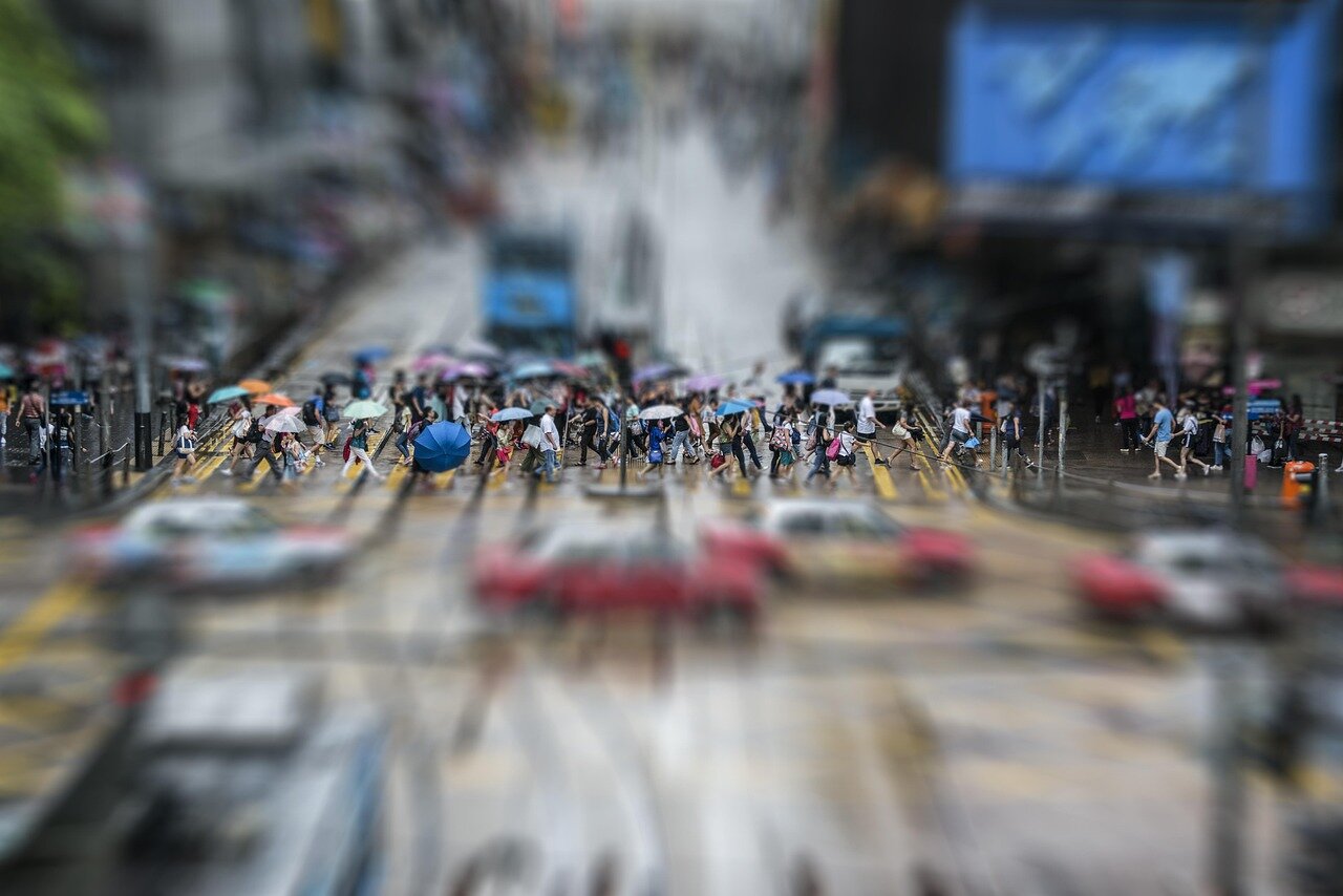 A celebratory gathering in Hong Kong, where local authorities and residents express pride and excitement over the astronaut's historic journey