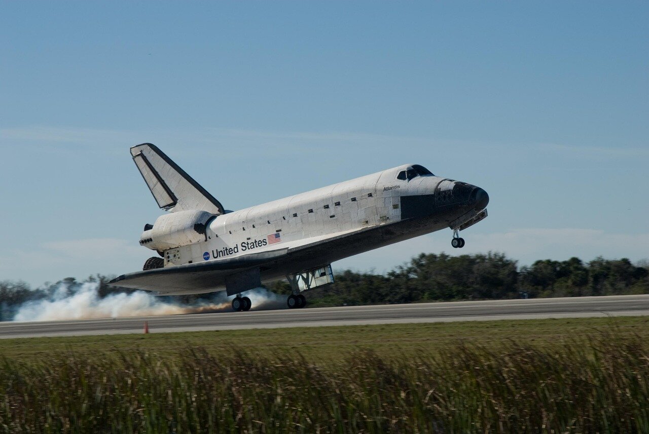 NASA officials discuss plans for a permanent Moon base during a press conference, highlighting the importance of the Lunar Gateway and upcoming Artemis missions.