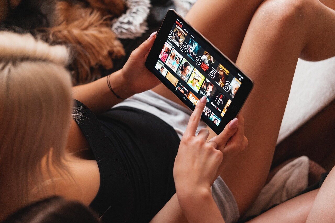 Viewers bingewatching His & Hers at home, illustrating the shift towards ondemand streaming and the popularity of serialized storytelling