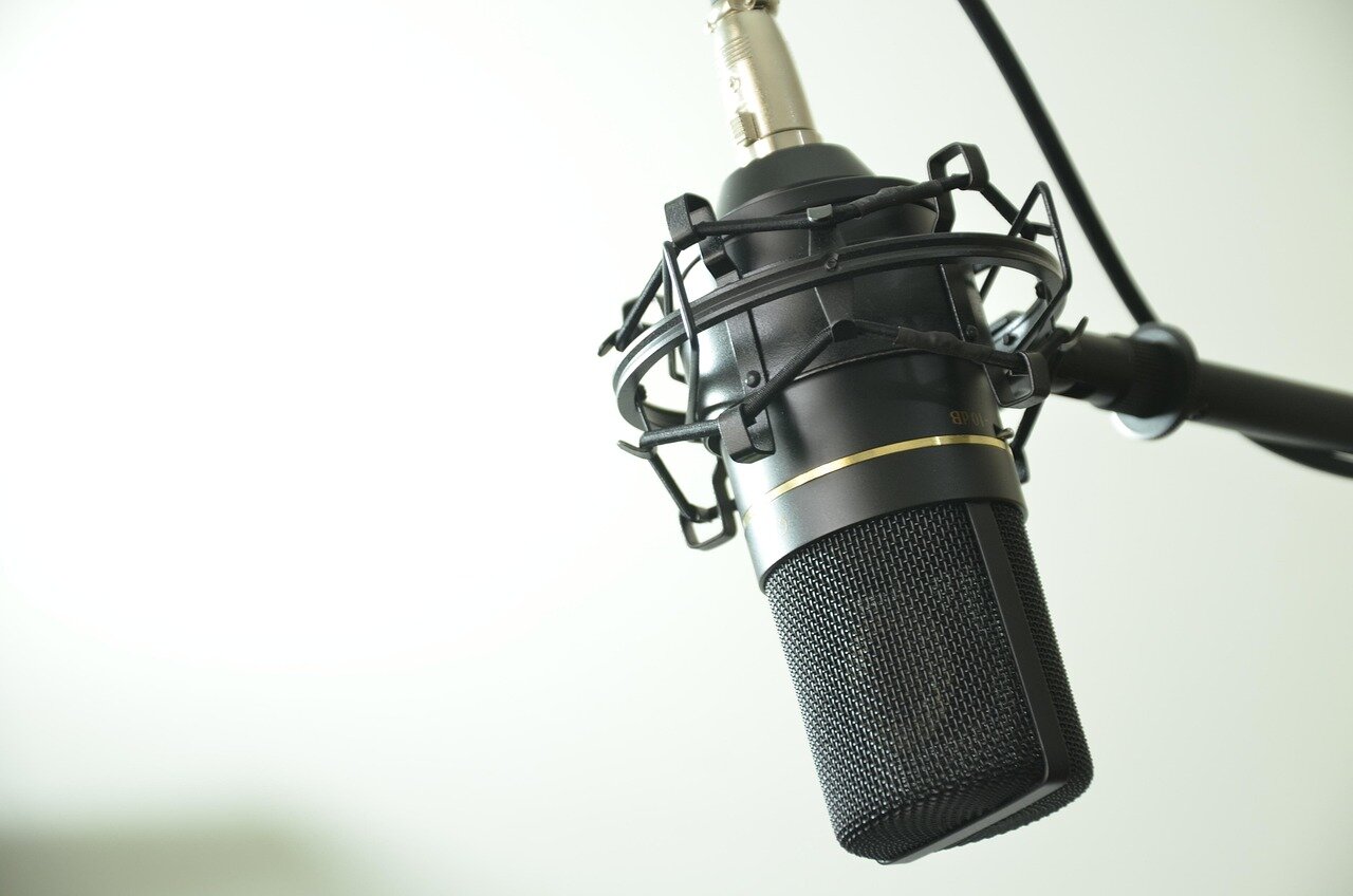 A diverse group of listeners enjoying a podcast episode, highlighting the growing popularity of audio content among various demographics