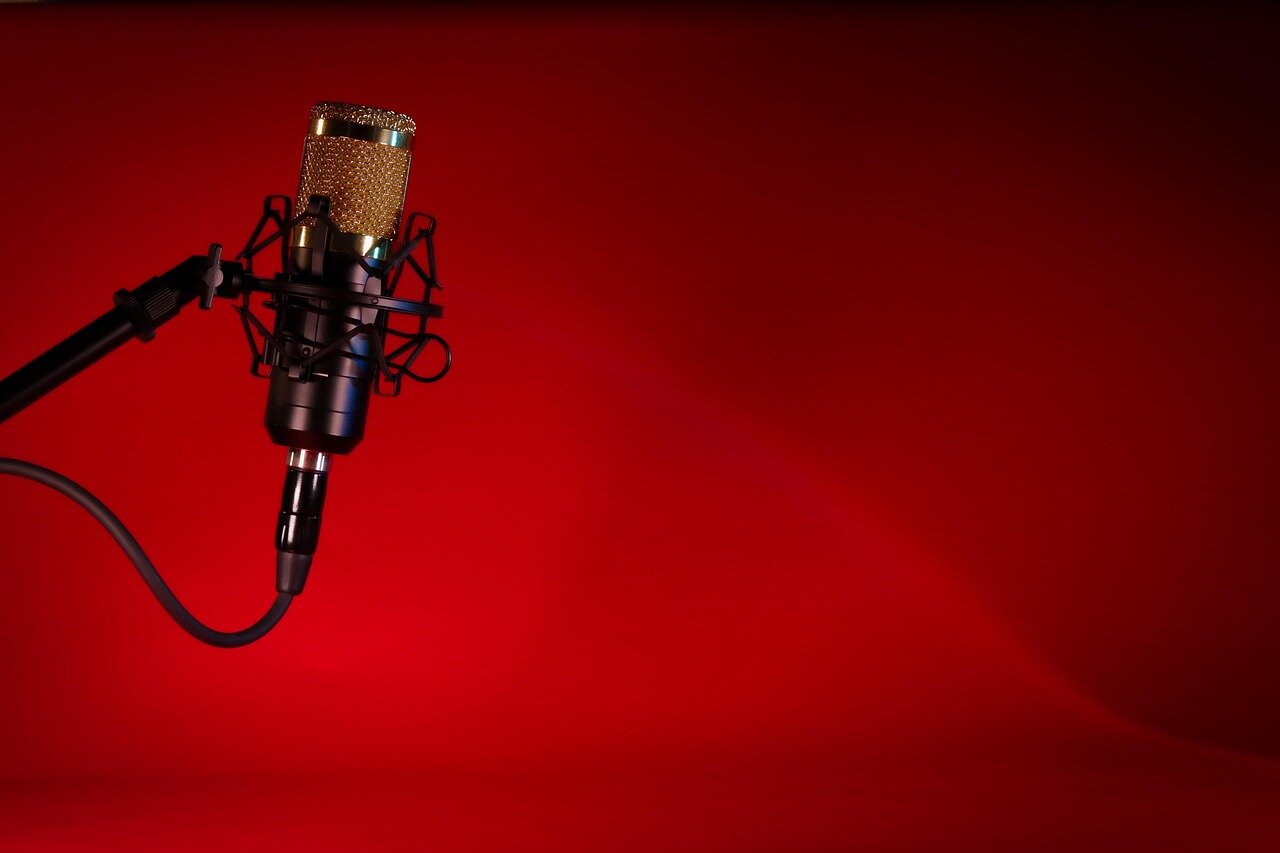 A closeup of a microphone and recording equipment set up for a podcast session, symbolizing the behindthescenes preparation for NewsNation's new initiative