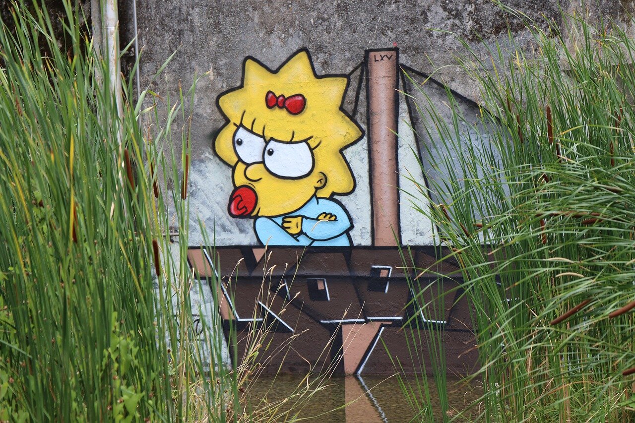 A composer is seen in a studio surrounded by various custommade instruments, intently working on the score for a new episode of The Simpsons Treehouse of Horror.