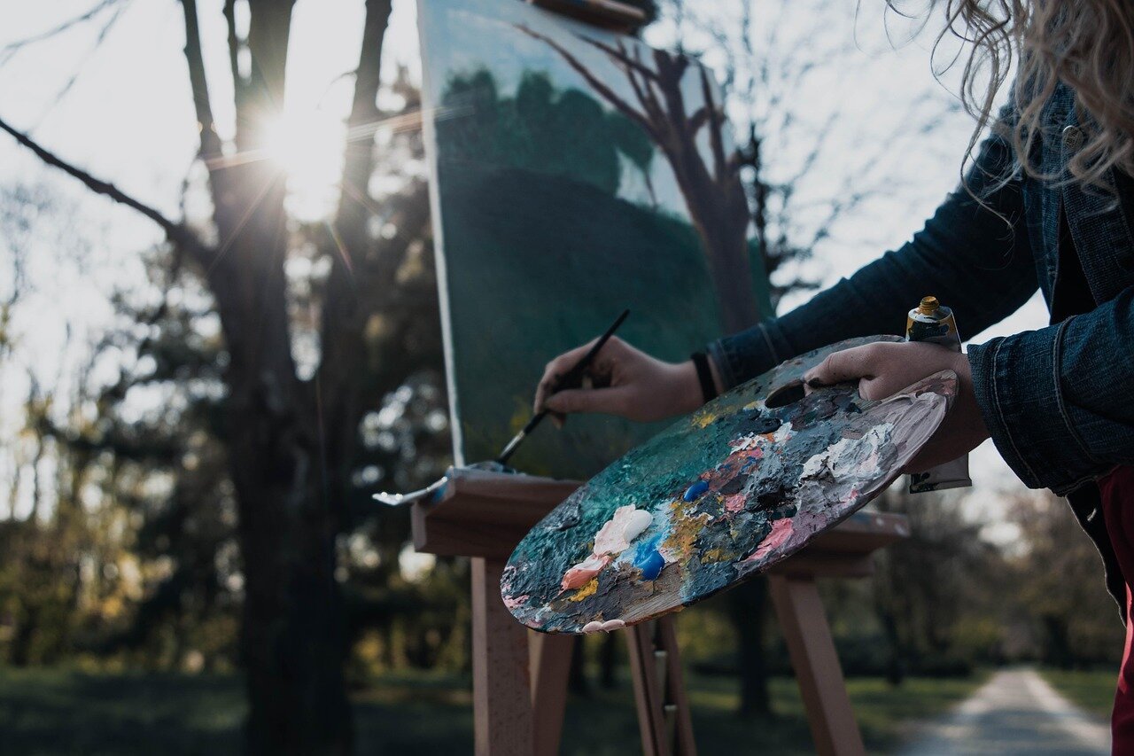 A bustling workshop where participants are creating their own artworks under the guidance of experienced local artists in Catskill