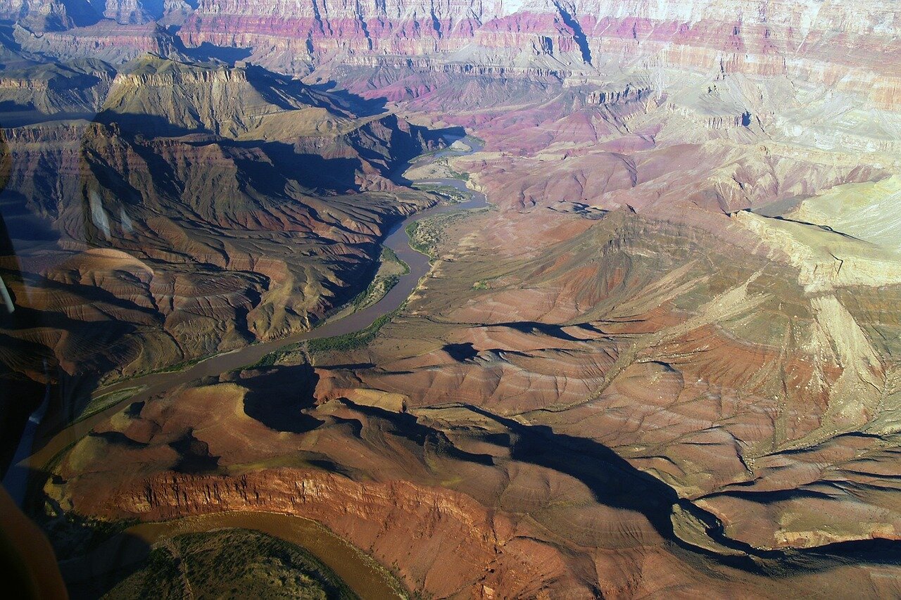 State officials gathered around a conference table, engaged in heated discussions about water usage and allocation amid rising tensions among Colorado Riverdependent states