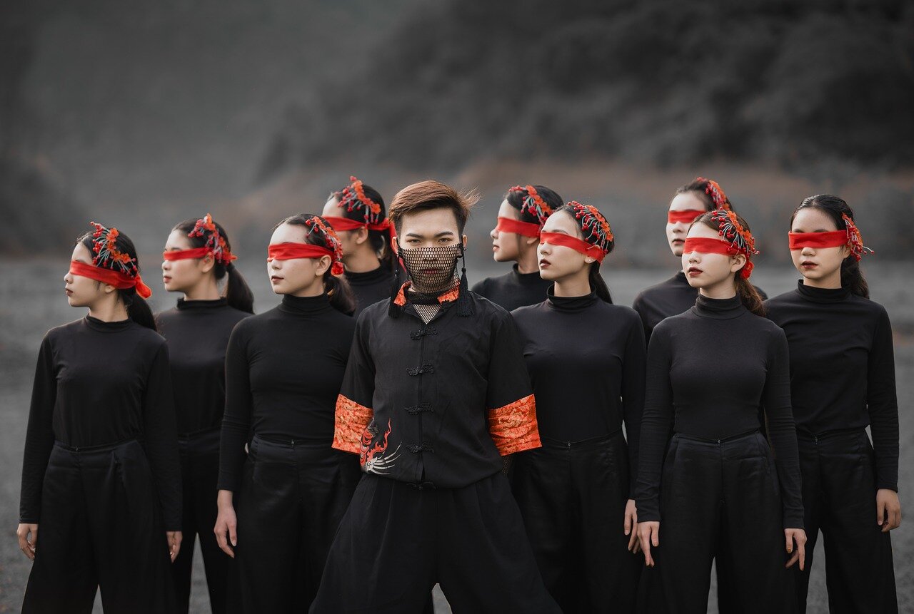 Dancers of various ages perform together on stage, showcasing their skills and celebrating the joy of movement in a vibrant display of creativity and collaboration.