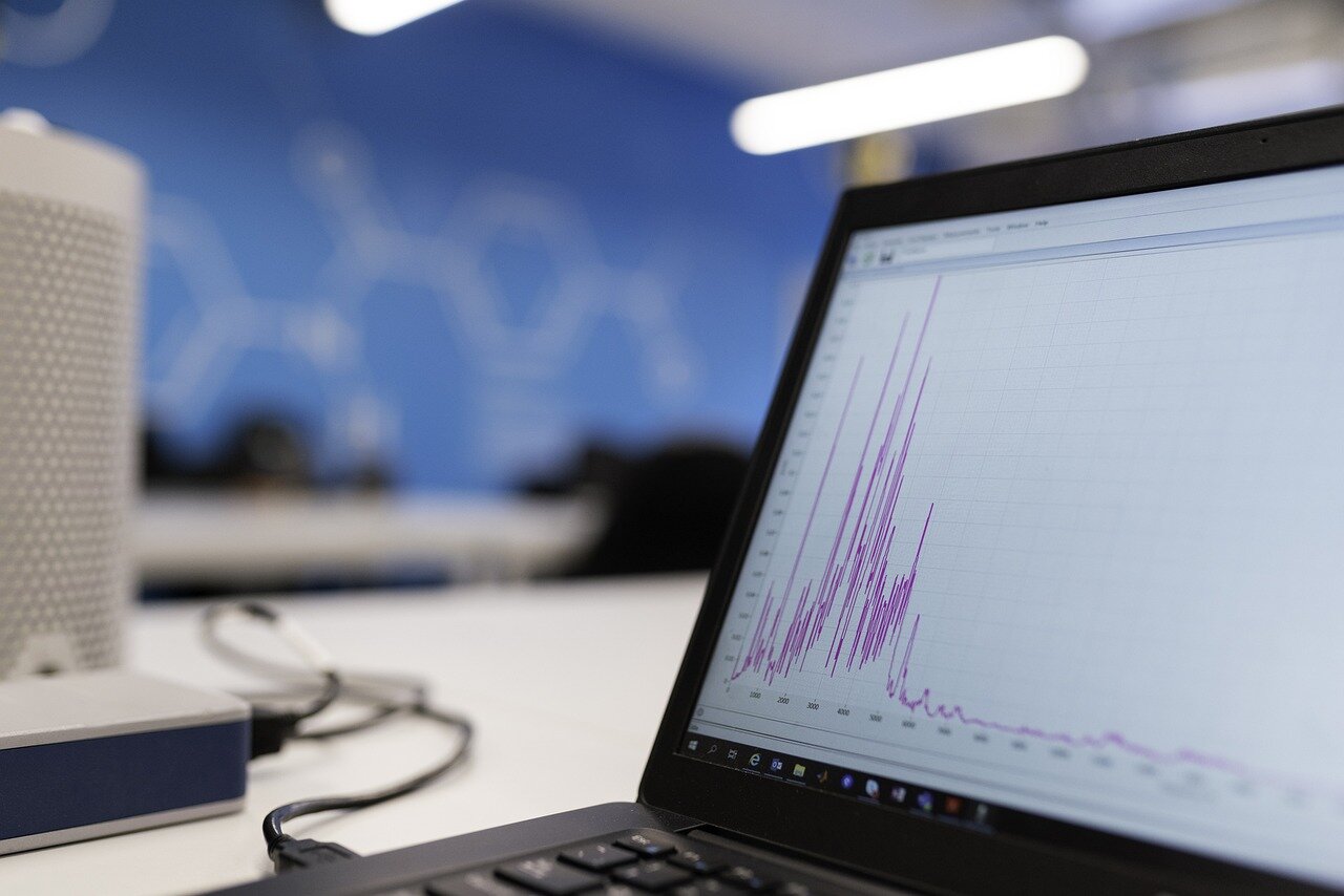 A business meeting where team members analyze data reports, emphasizing the potential impact of flawed data on strategic decisionmaking