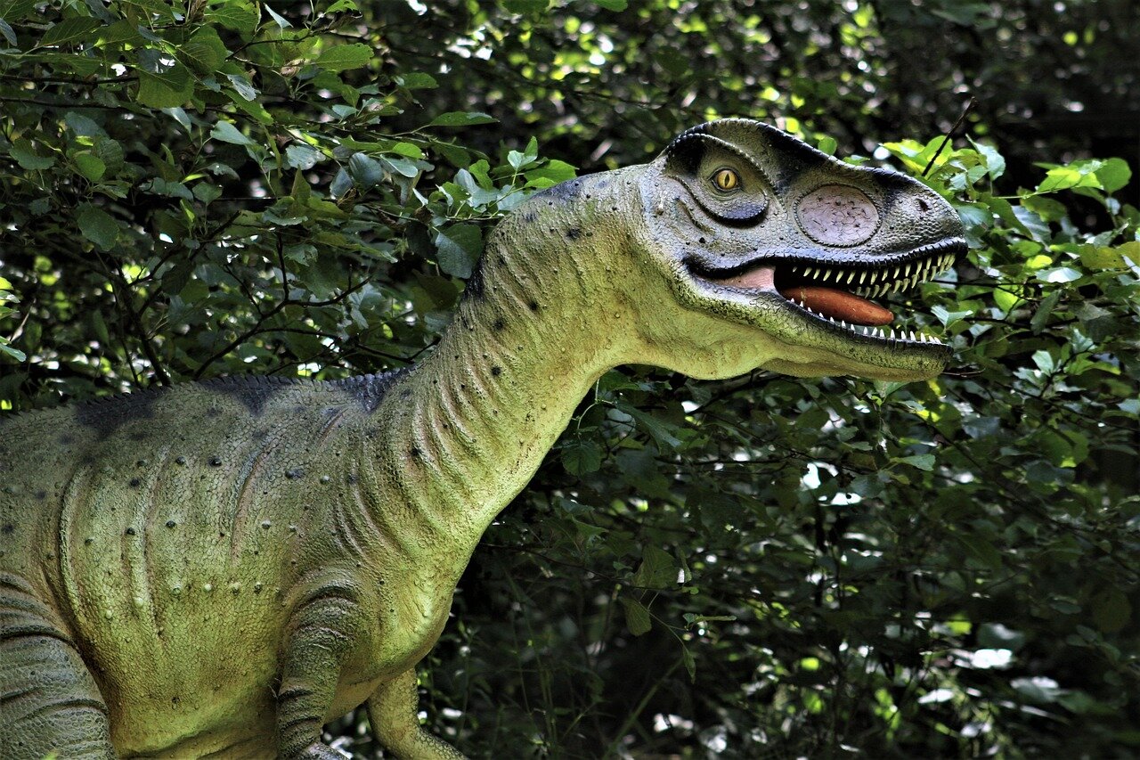 Paleontologists examine fossilized remains of small, feathered dinosaurs in a lab, discussing their adaptations and survival strategies following the asteroid impact that led to the extinction of nonavian dinosaurs.