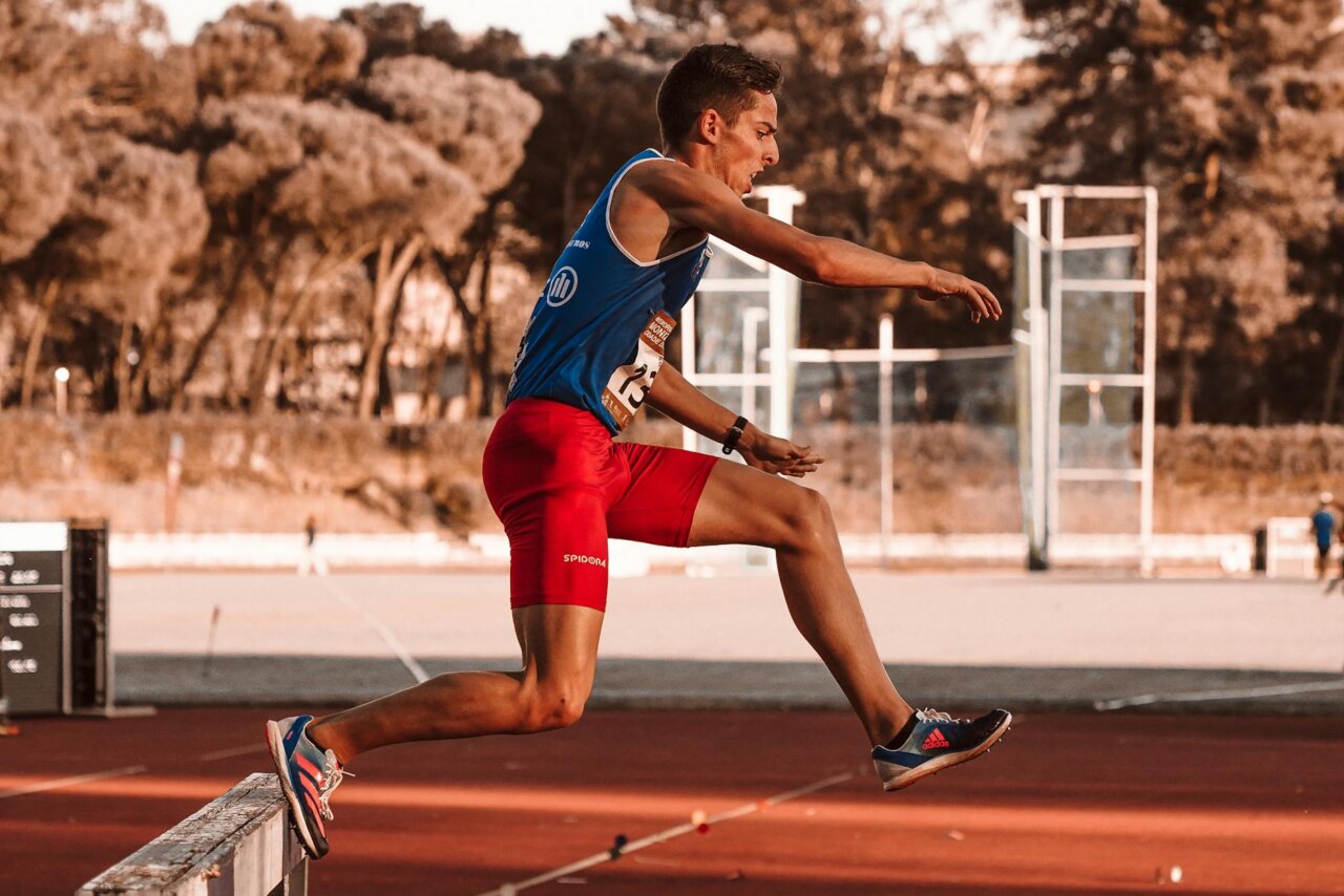 The atmosphere is charged with anticipation as spectators react to Duplantis' surprising performance, highlighting the pressures of competing at home