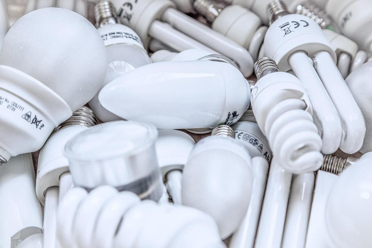 A meeting of policymakers discussing energy strategies, highlighting the tension between achieving net zero emissions and ensuring affordable electricity for citizens