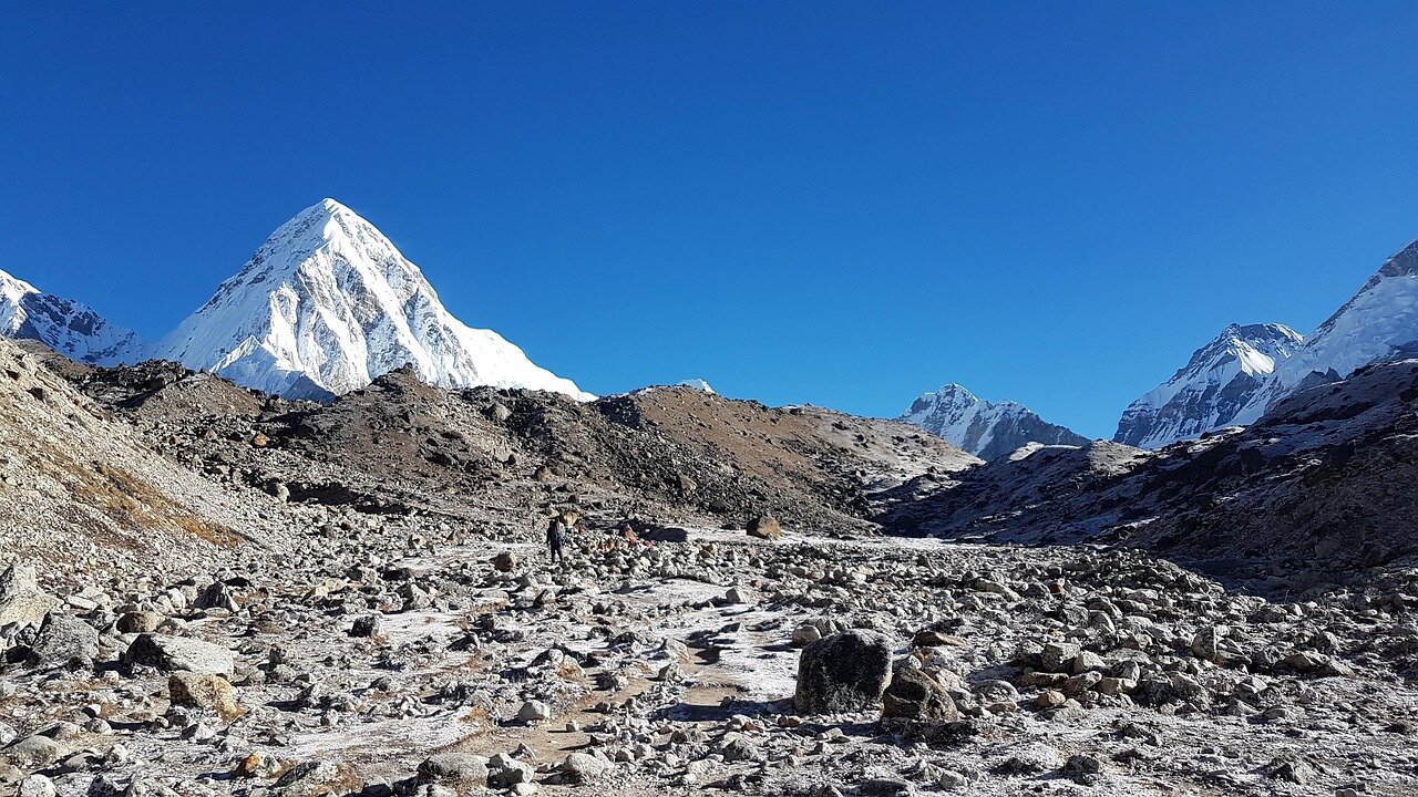 A panoramic view of the treacherous Everest landscape, showcasing the extreme weather and challenging terrain faced by climbers