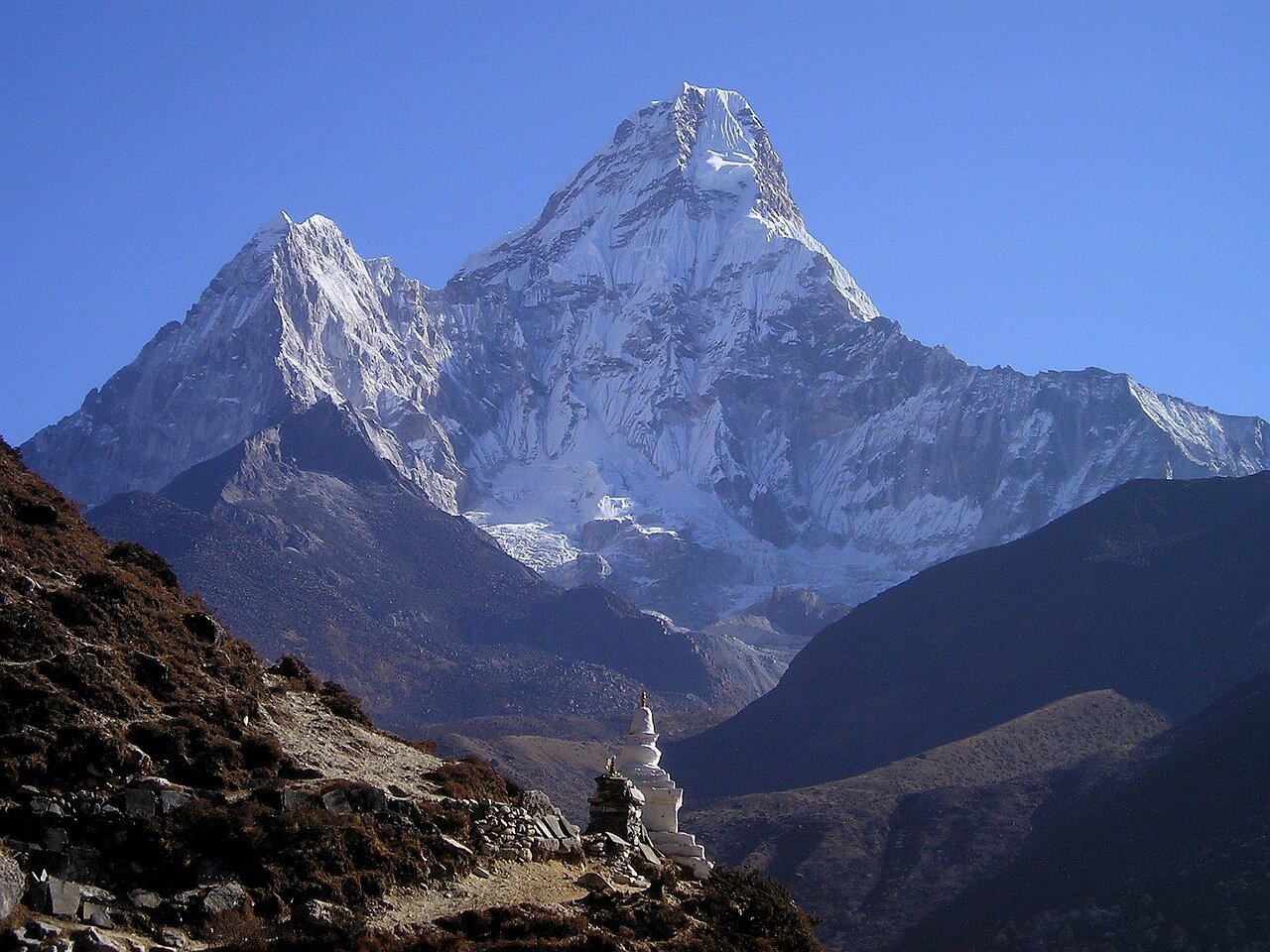 A bustling scene at the base camp of Everest, illustrating the growing number of climbers and the commercialization of mountaineering on the world's highest peak