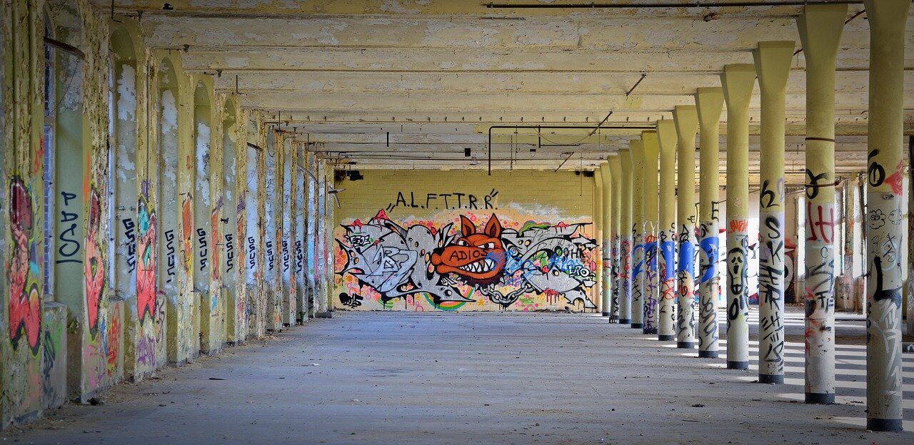 Wildlife experts examining the factory's exterior for potential points of entry used by the bear