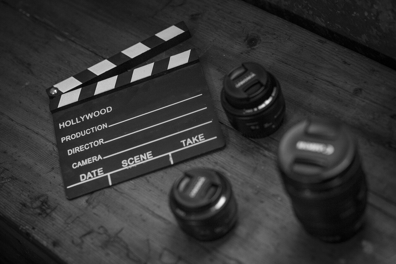 A group of independent filmmakers collaborating on a project, empowered by accessible AI tools