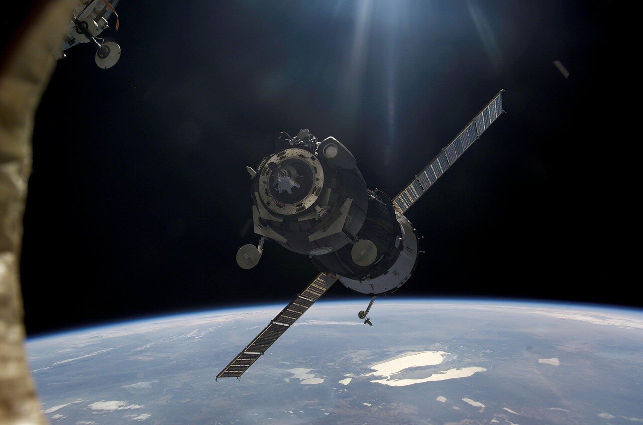 The International Space Station orbits Earth, symbolizing international cooperation in space exploration amidst ongoing challenges
