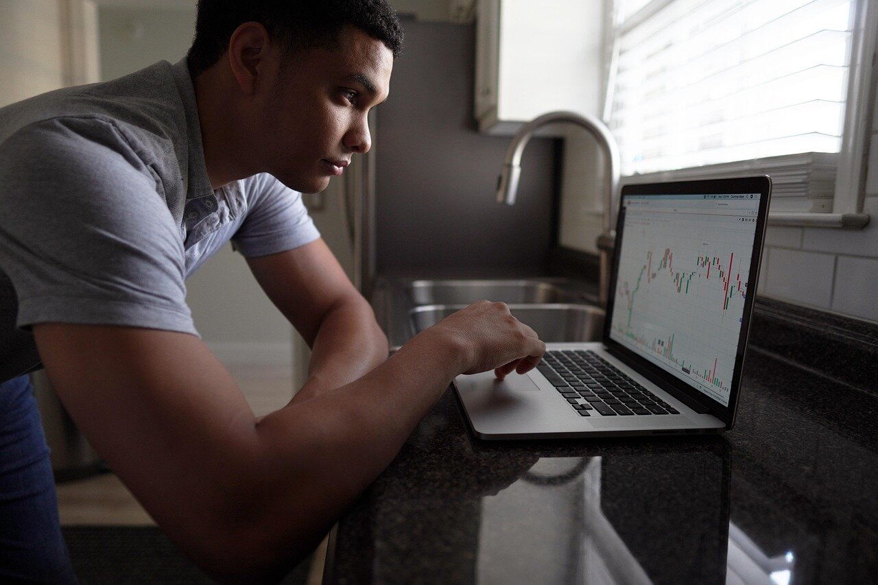 A family gathered around a table, calculating savings for children's education, reflecting the financial responsibilities faced by individuals in their 30s and 40s