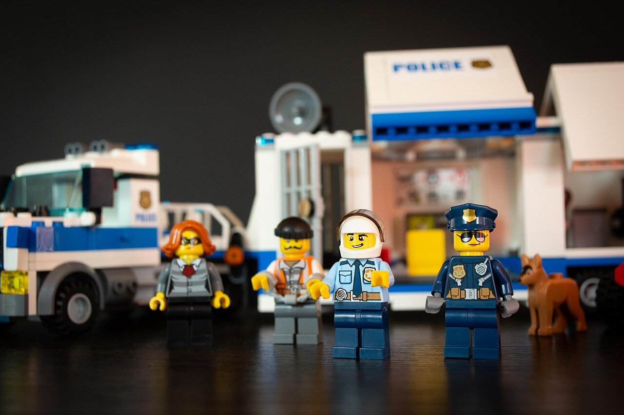 A promotional event featuring KPop music and Lego building activities, capturing the dynamic interplay between fandom and creativity