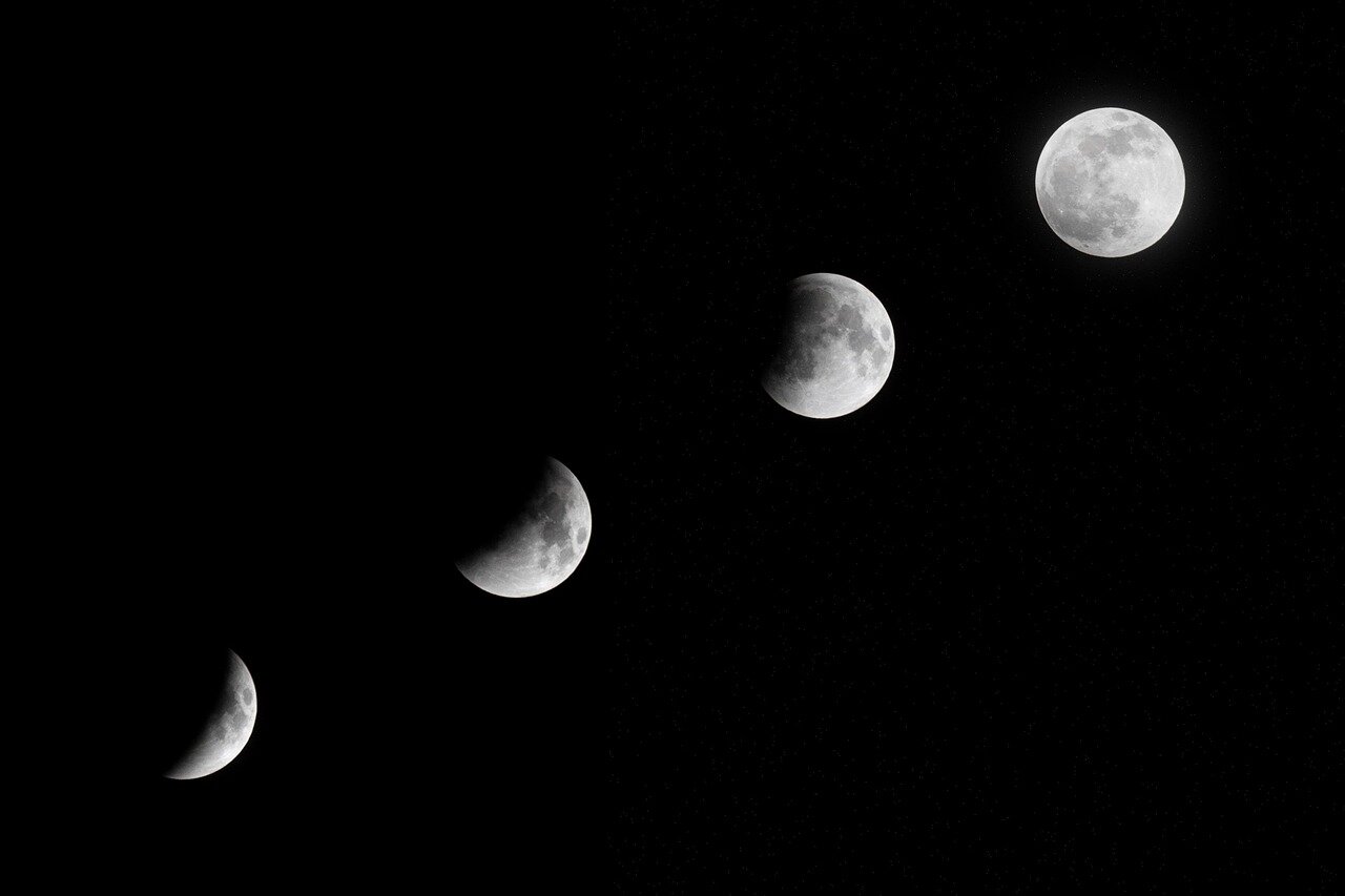 A community event celebrating the super new moon, where families engage in educational activities about the cosmos and its influence on Earth