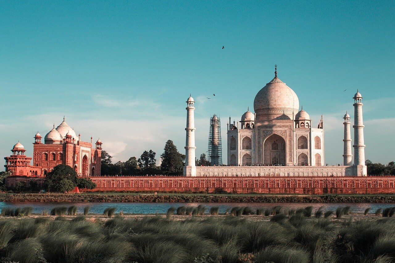 Diverse communities engage in cultural exchanges, illustrating the rich tapestry of religions and traditions coexisting within Mughal society