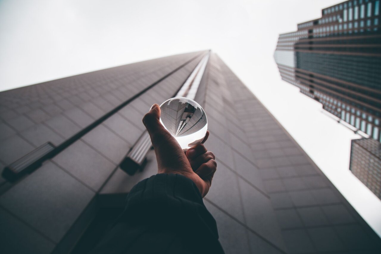 An office setting where city officials are engaged in a serious discussion about the implications of technology in policing, highlighting the tension between privacy concerns and law enforcement needs