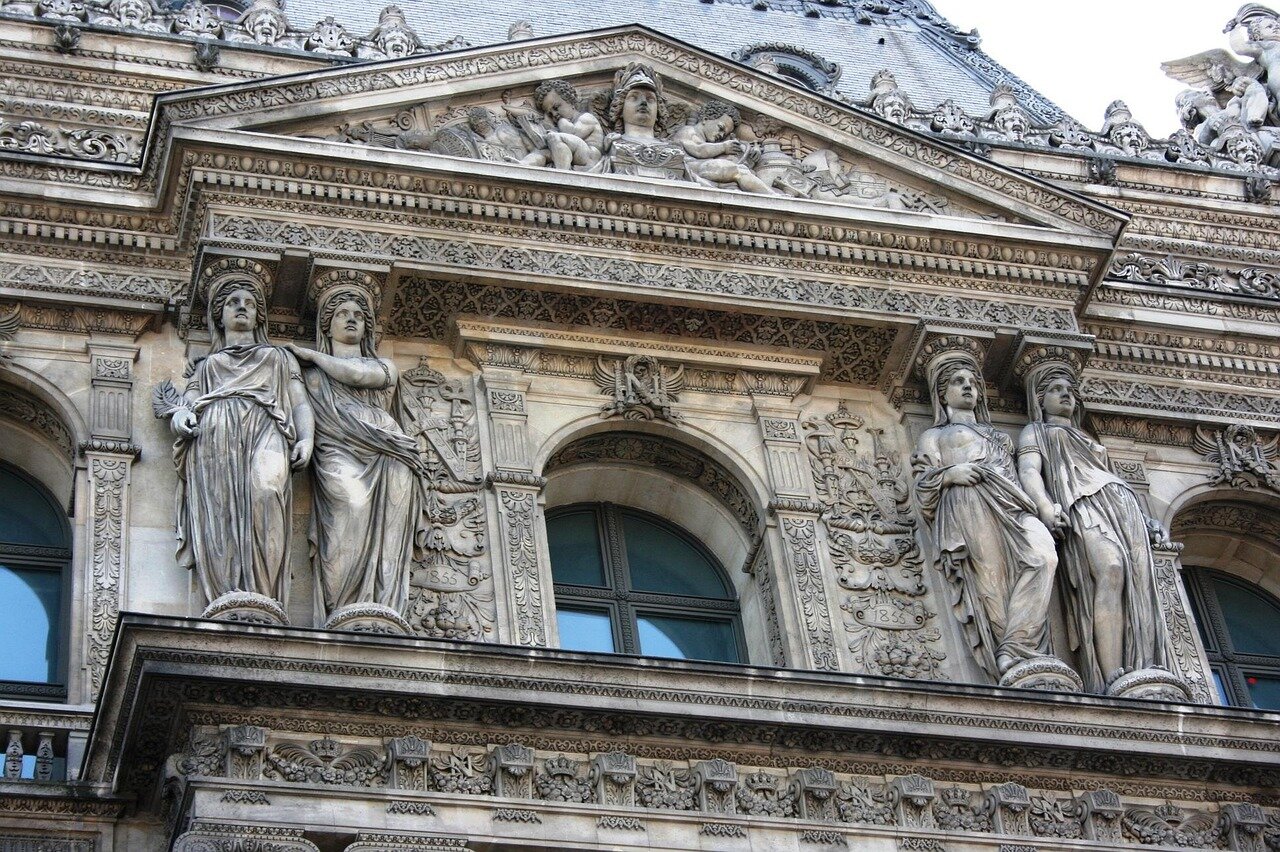 A bustling crowd gathers outside a modern esports venue in Paris, eagerly anticipating the upcoming Esports World Cup scheduled for June 2024.