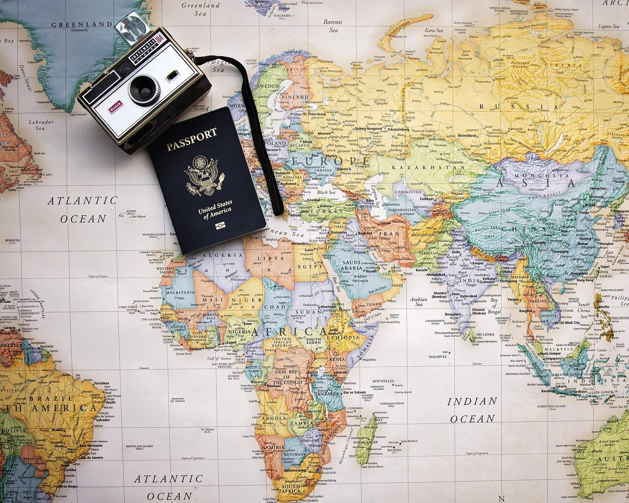 Jodie TurnerSmith smiles while holding her wellworn passport, reflecting on the stories and adventures it represents during a recent interview.