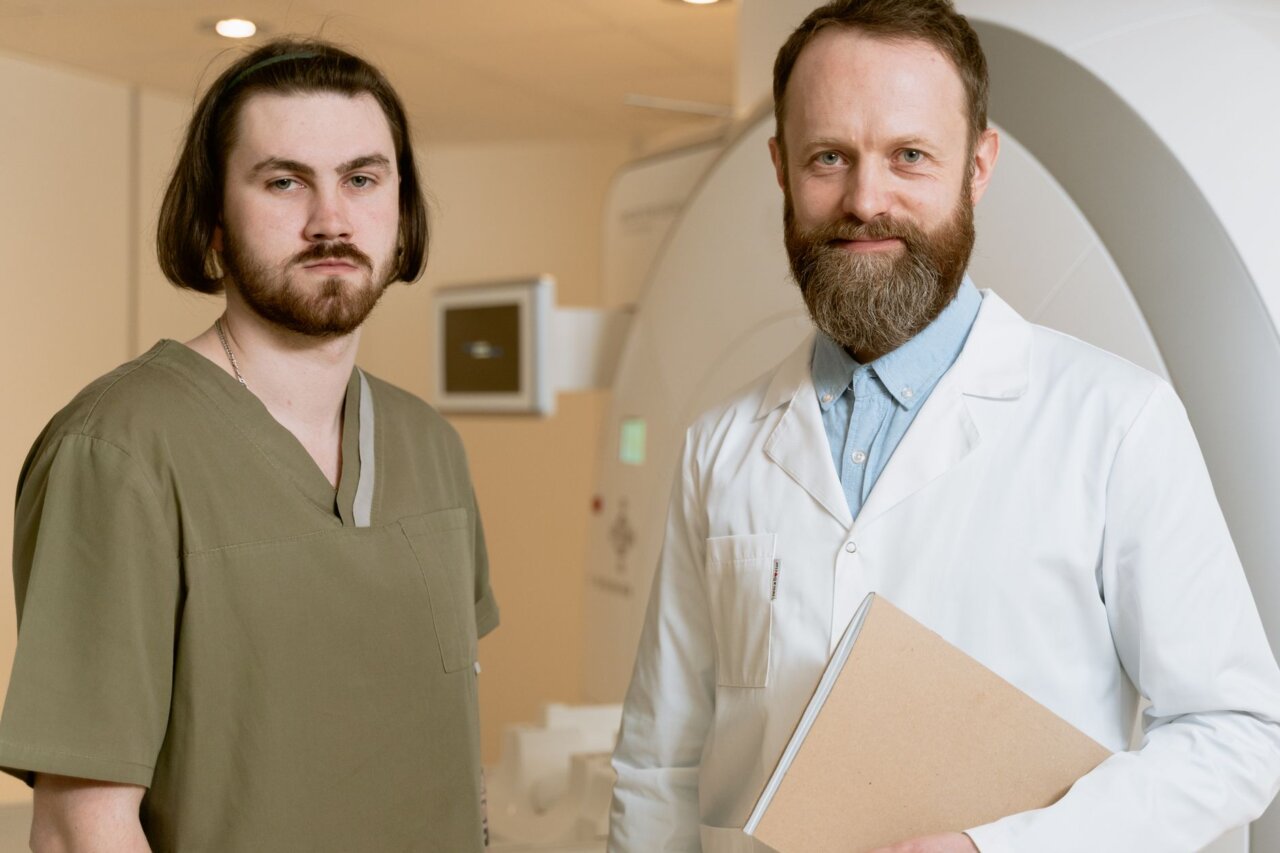A medical team discussing the implementation of new radiotherapy techniques aimed at improving patient outcomes in a hospital setting