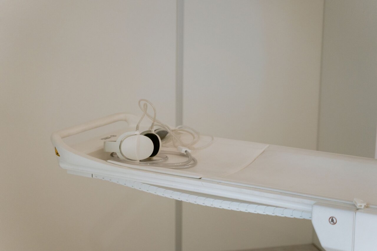 A healthcare provider examining data on the economic benefits of advanced radiotherapy and its impact on patient care and resource allocation