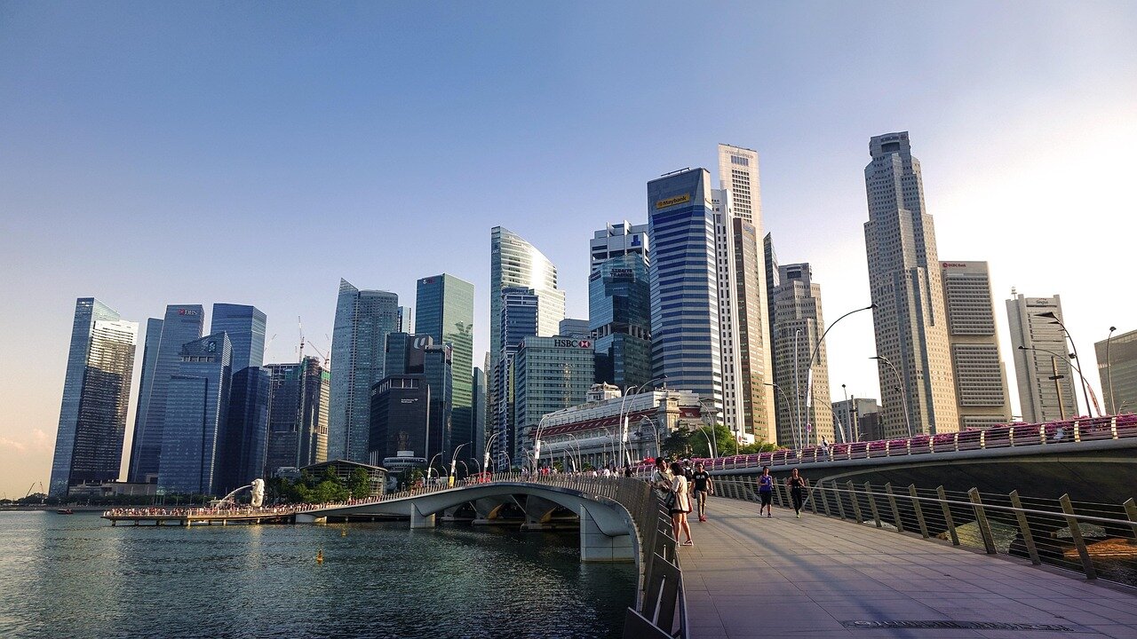 A lively discussion among local filmmakers and cultural organizations at a community forum, addressing the impact of foreign films on Singapore's identity and representation in cinema