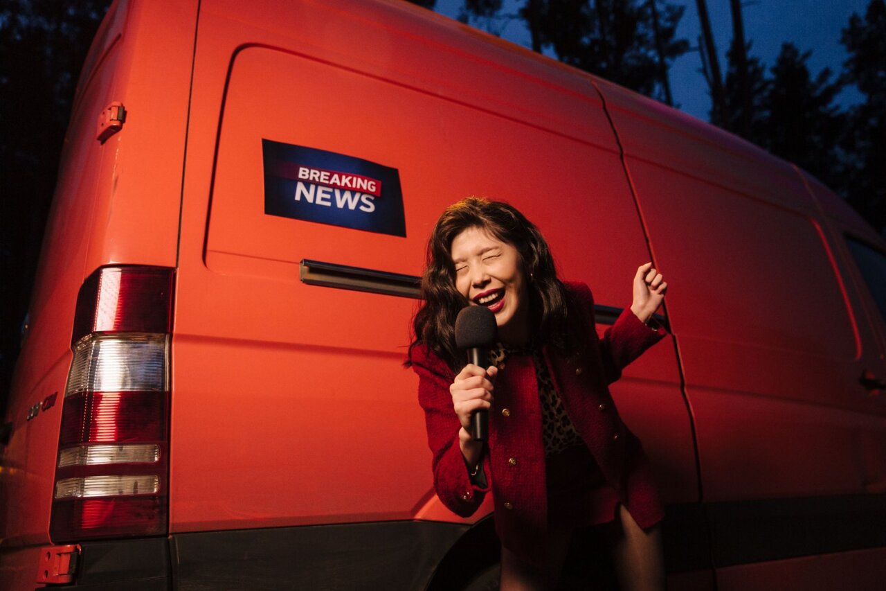 Bowen Yang, Sarah Sherman, and Kenan Thompson sit together in a studio, engaged in a thoughtful discussion about their experiences and the legacy of Saturday Night Live.