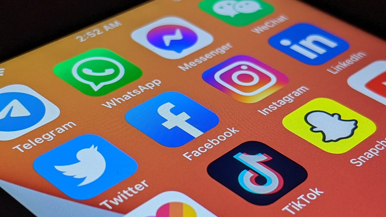 A visual representation of social media platforms, illustrating the diverse tools available for communication and creativity, amidst the debate on their impact on young users