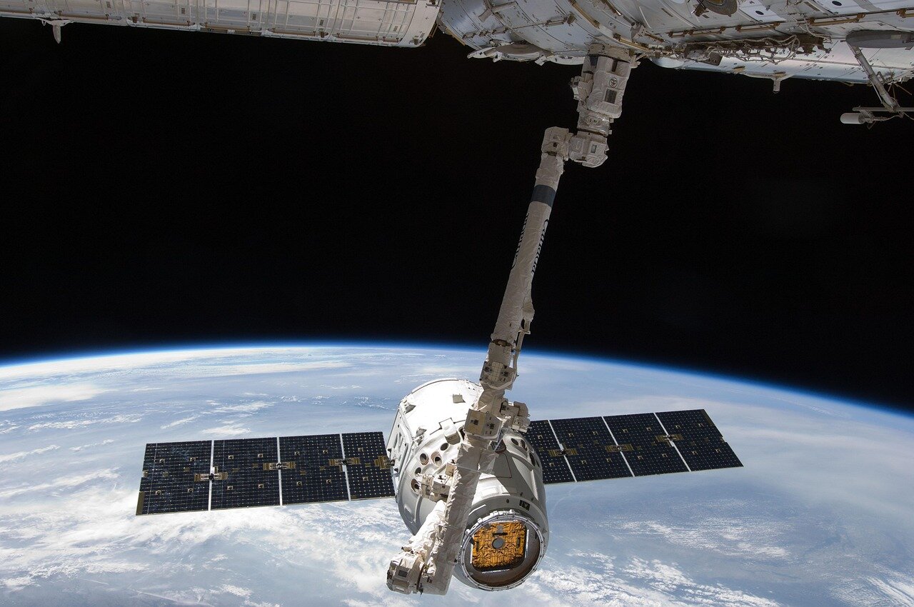 Engineers at SpaceX collaborating on technical designs and innovations, reflecting the company's commitment to cuttingedge aerospace technology