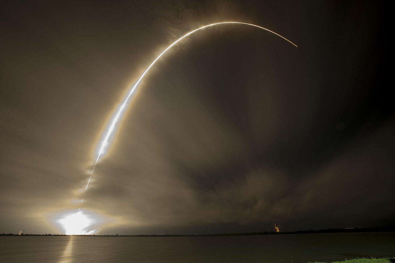 A visual representation of the Starship rocket soaring through the sky, illustrating SpaceX's ambitious goals for future space missions and colonization efforts