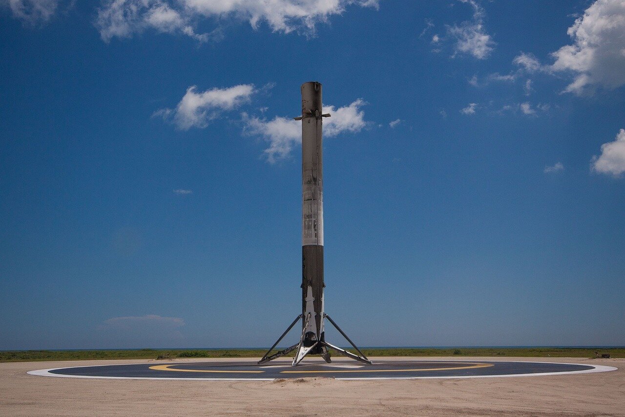 A bustling SpaceX facility in Texas, showcasing engineers and technicians working on innovative rocket technologies and the Starship program